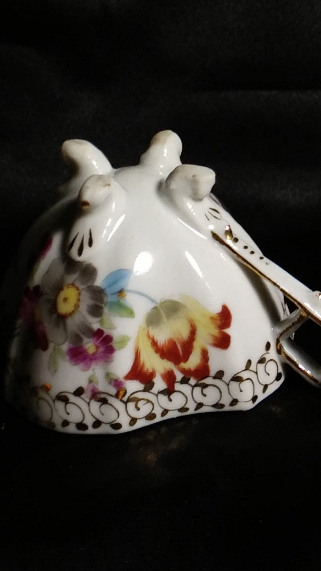 Miniature Porcelain Tea Cup. Four Footed Hand Painted Gold Trim