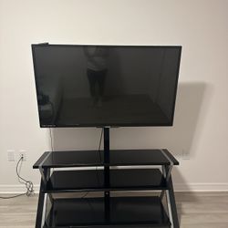 65 Phillips Tv With Roku And Tv Stand