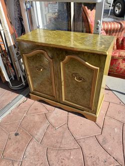 vintage two-door olive-green and gold-gilded cabinet