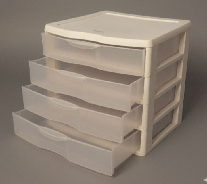 Compact white plastic storage drawer. Ideal for organizing small items. Size: 14.5" X 13.5" X 10.5".