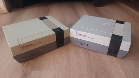 Two junk Nintendo Entertainment Systems for parts