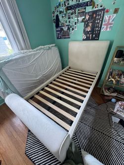 Twin bed frame (upholstered and lightly used)