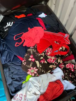 Container filled with clothes, probably more than 100 pieces Container filled with clothes, probably more than 100