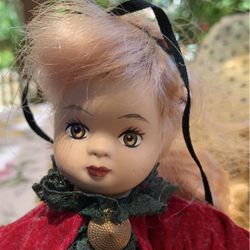 Vintage porcelain Christmas doll 9 inches tall