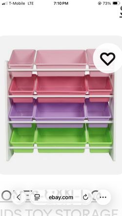 Shelves with plastic pastel Bins for organizing toys etc