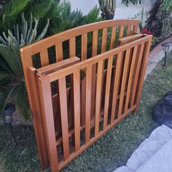 3 in 1 Wooden collapsible baby crib must go.
