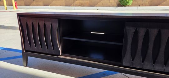 Dark Wood TV Stand with Sculpted Doors