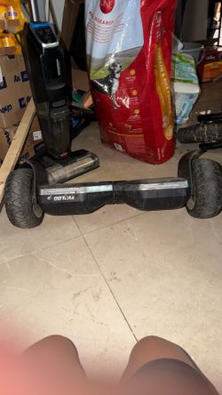 This is a black all-terrain hoverboard, similar to models like the Gotrax SRX Pro with Bluetooth