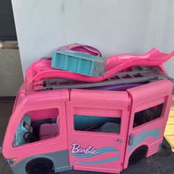 Backpack, barbie van and bike