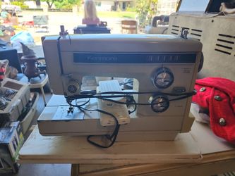 vintage Kenmore sewing machine, likely a model from the 158 series,