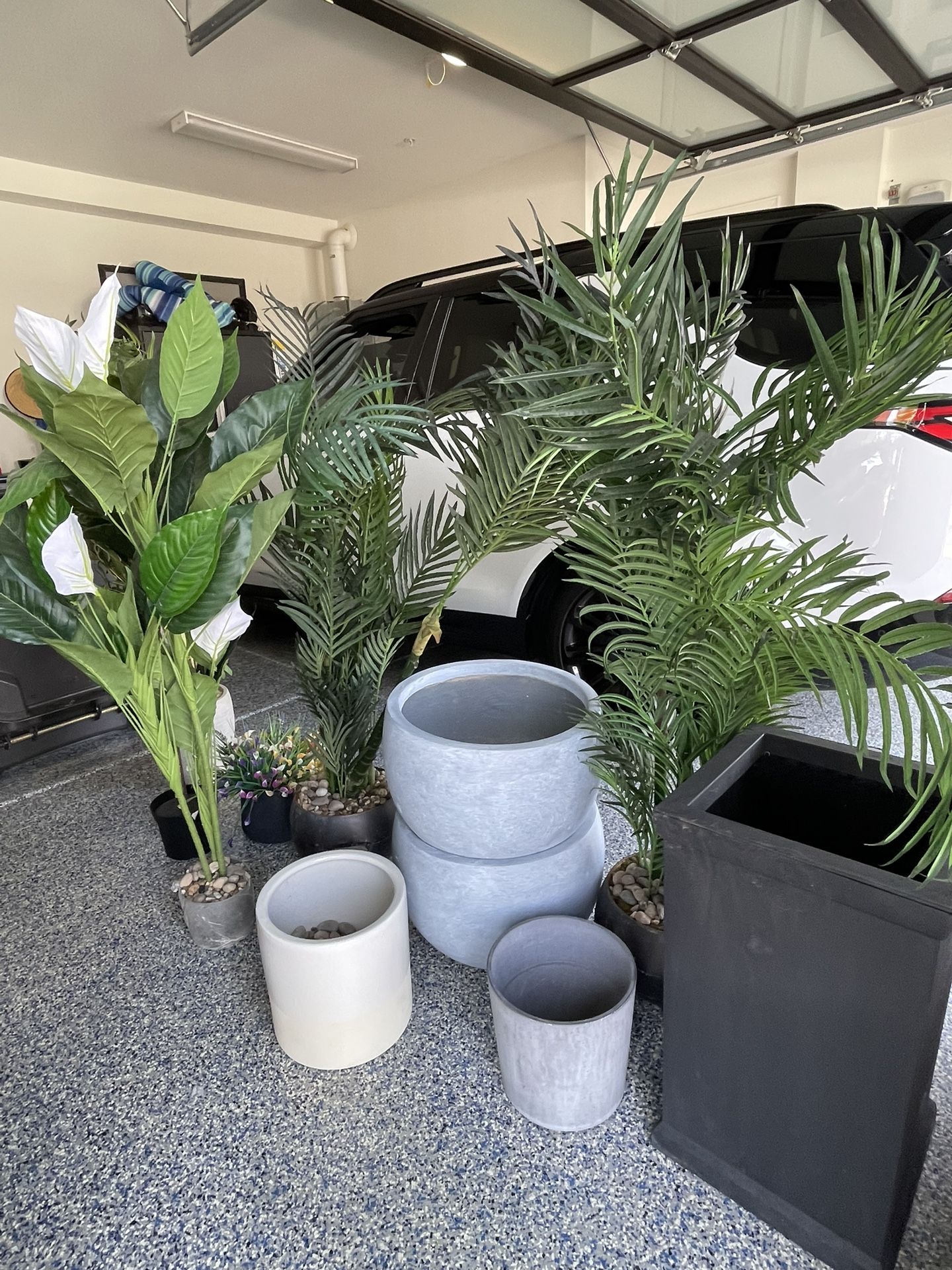 Pots plants and stone boy