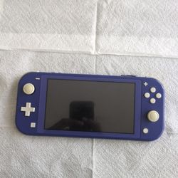 Nintendo Switch Lite, Blue, 2 Games Included.