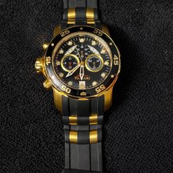 Gold & Black Chronograph Watch – Luxury Style