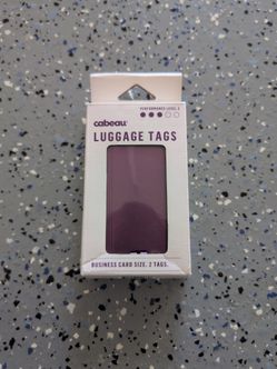 Set of purple Cabeau luggage tags