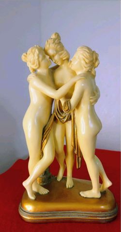 "The Three Graces" Figurine Signed O. Tupton – Faux Ivory & Gold Tone Accent (approx. 10")
Beautiful vintage figurine depicting The Three Graces in a 
