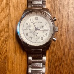 Michael Kors watch.     Original.    Just needs battery.  