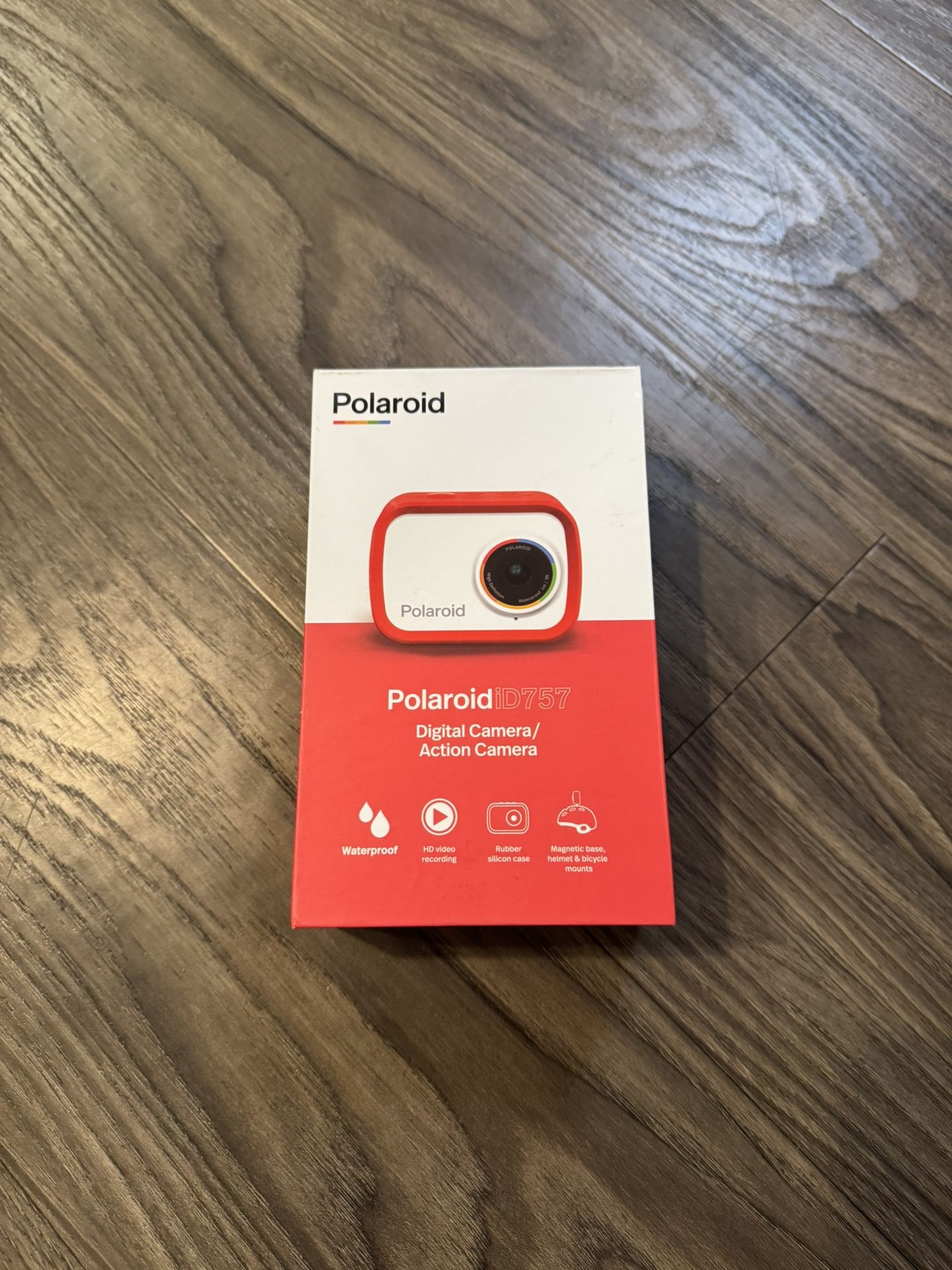Brand new, never used Polaroid iD757 digital action camera — open box. Features 18MP photos, HD video recording, waterproof rubber silicon case (up