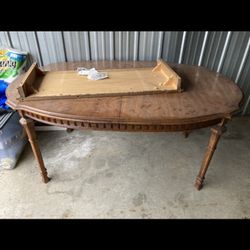 Antique 1950s dining table. Beautiful condition. Comes with table leaf. $200. Must go this week