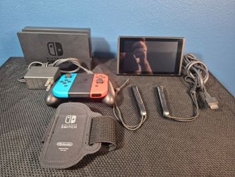 Nintendo Switch console with dock, Joy-Cons, and accessories