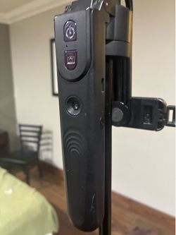 Jmary KT-299 AI face-tracking selfie stick tripod, which features a detachable Bluetooth remote.
