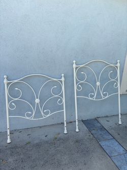 Pottery Barn vintage twin white metal bed with matching headboard and footboard.