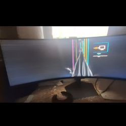 a Samsung Odyssey G9 series ultrawide curved gaming monitor