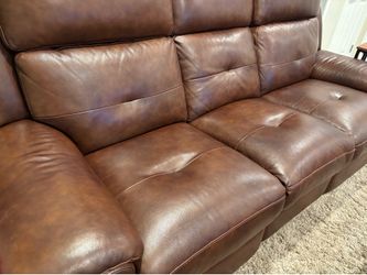 Brown reclining leather sofa