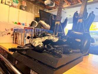 PlayStation 4 bundle. Guitars and charging stations, remotes and charging stations, VR with move all wires and instructions. 37 games.