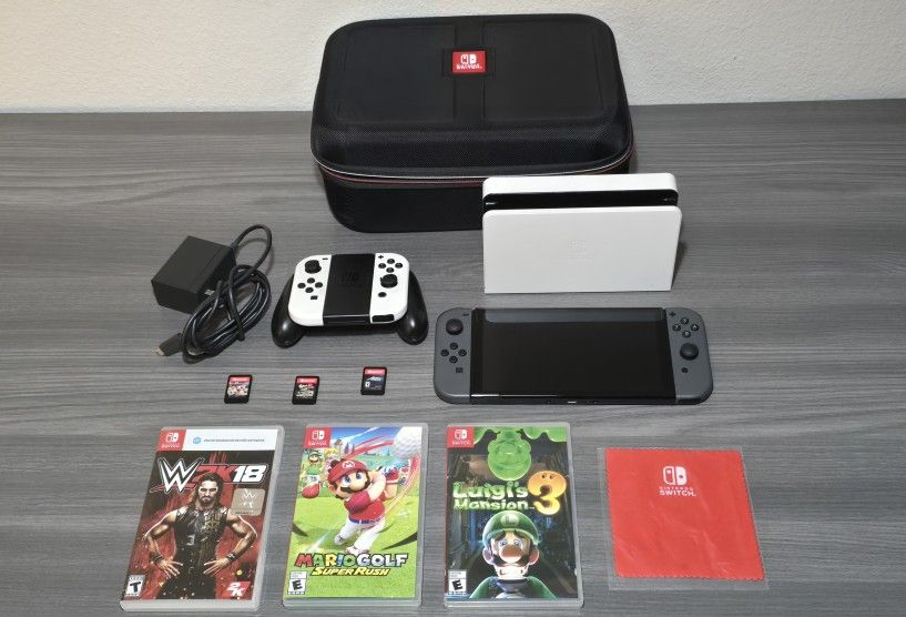 Nintedo Switch OLED bundle with 6 Games, extra controllers and more!