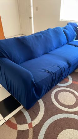 Brown L-Shaped Couch With Blue Cover