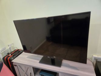 Samsung 55 inch TV w/ Glass top pivoting stand