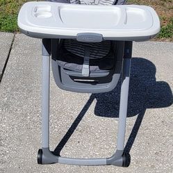 High Chair -foldable and has wheels