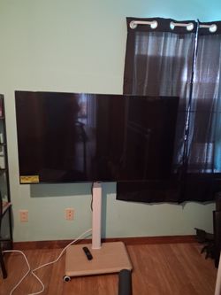 Large Flat Screen TV on Rolling Floor Stand