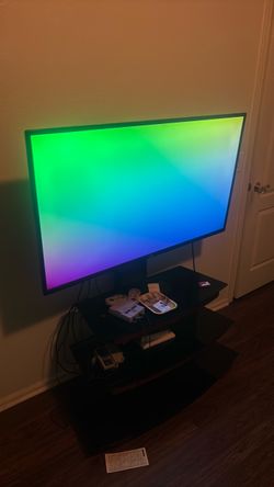 Phillips 50’ tv  with universal remote and stand