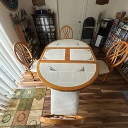 Table With 4 Chairs Included (round But Has Middle Insert That Makes It Oval Can Be Took Out)