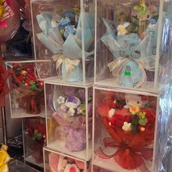 Vibrant artificial flower bouquets. Has many different styles and colors. Rose bouquets, lily bouquets, and some cute crocheted flower arrangements. G