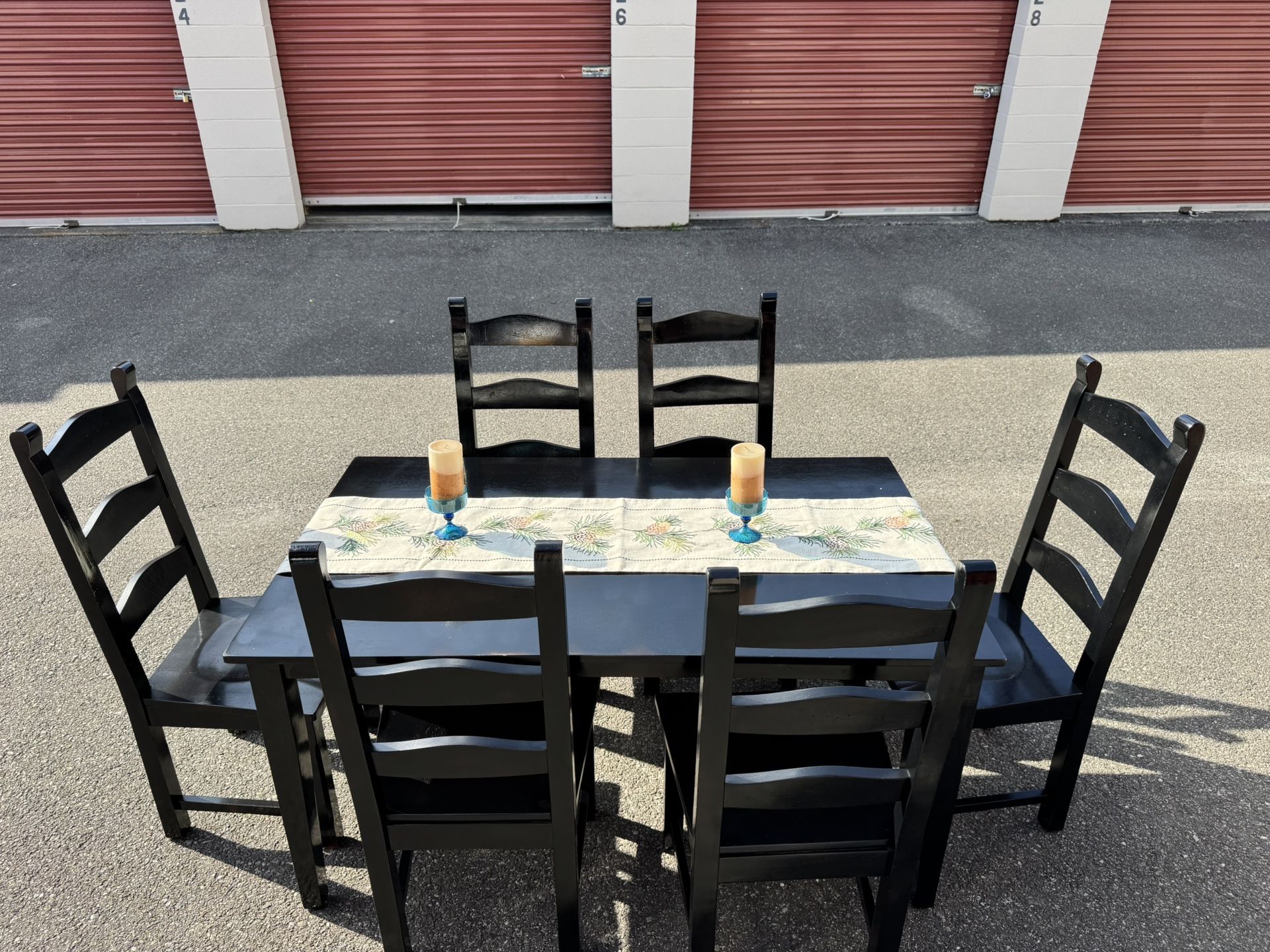 Black wooden table and six chairs