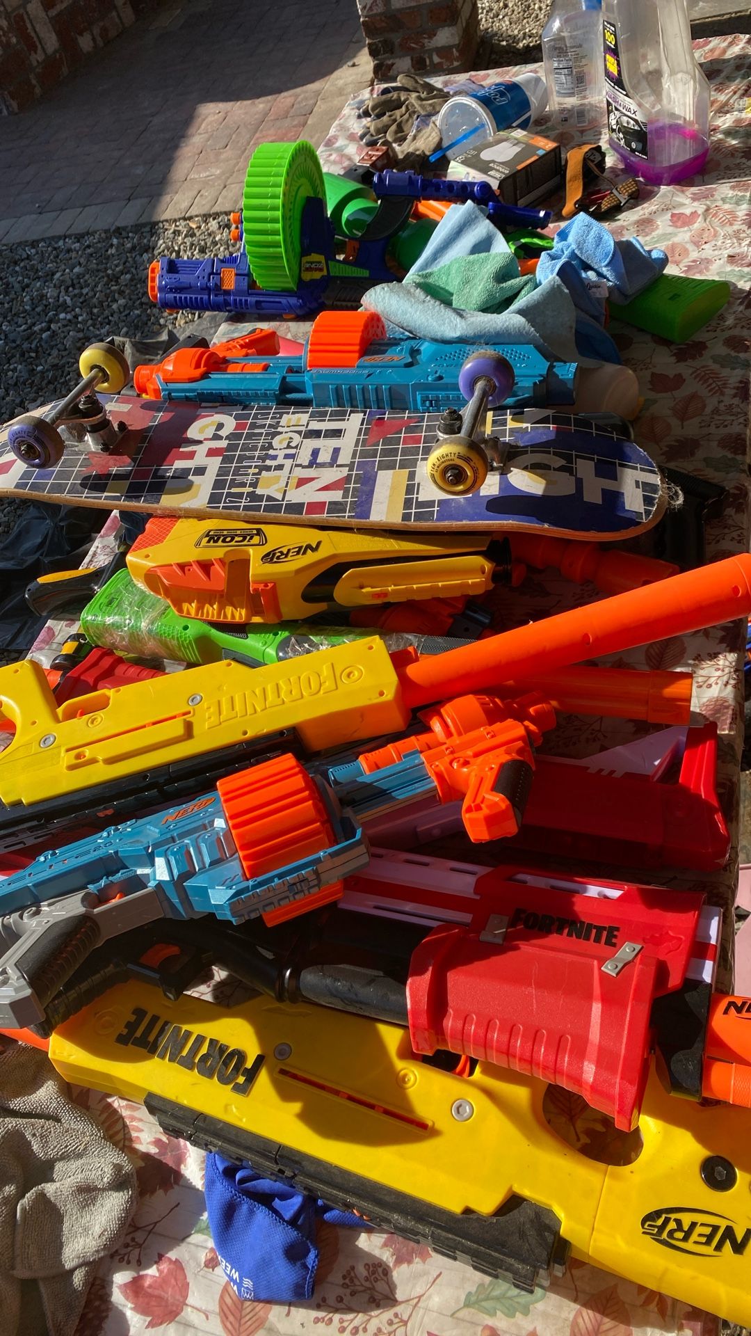 Nerf, guns and skateboard