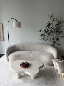 Curved Boucle Sofa in Cream and table