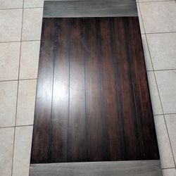 Wood coffee table with metal ends