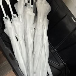 translucent white wedding umbrellas
