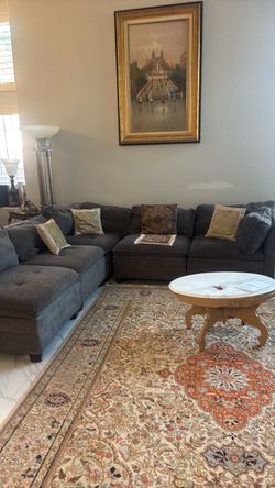 Barley used grey couch