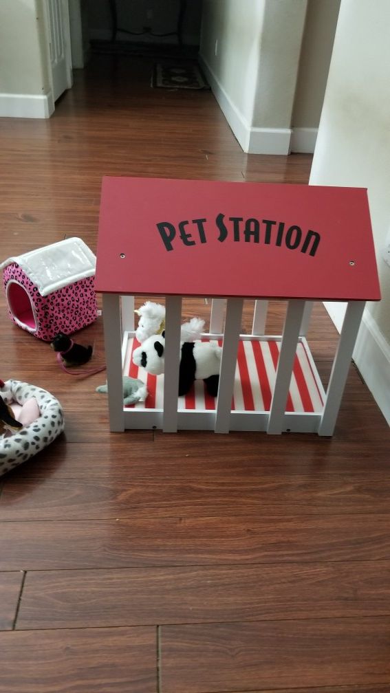 Wooden pet station with assorted justice dog items