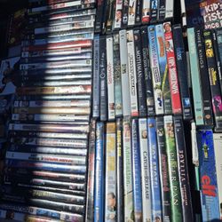 Multiple DVDs And VHS Tapes 