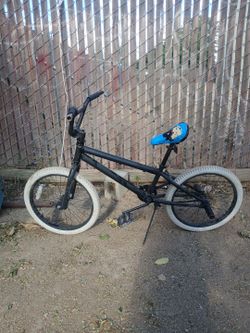 20 inch bmx bike asking for $85 negotiable price [black frame white tires with blue seat]