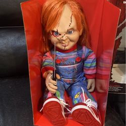 Brand new Chucky doll. He talks and moves his neck.