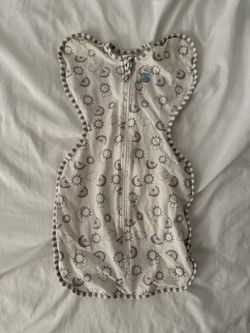 $10 Love to Dream Swaddle Up Original in a rainbow print allows babies to sleep with their arms in a natural upward position