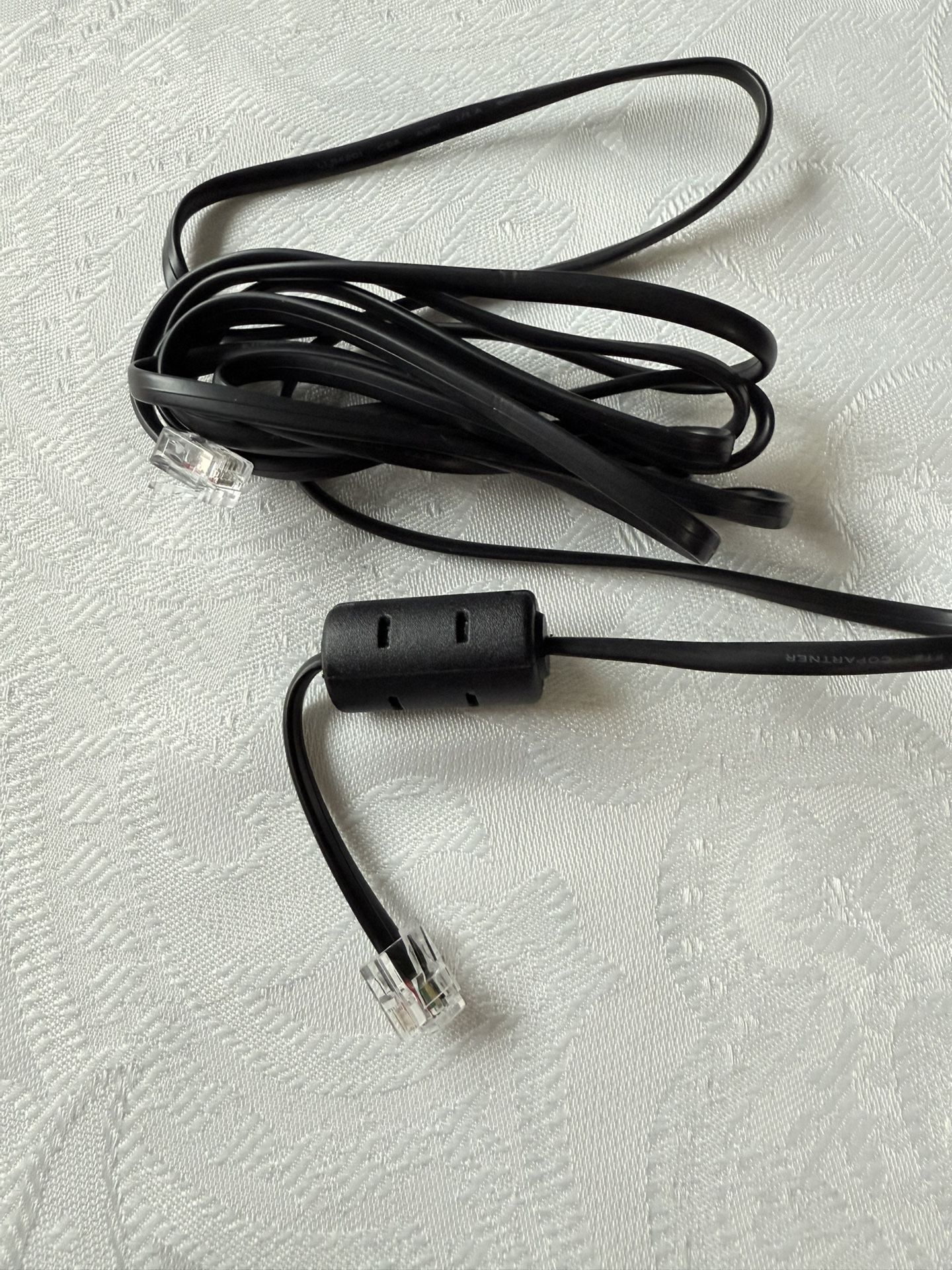Highest quality COPARTNER telephone cable with RJ11 connectors. New. Never used. Carries Ferrite Chokes protection. These devices are used to reduce e