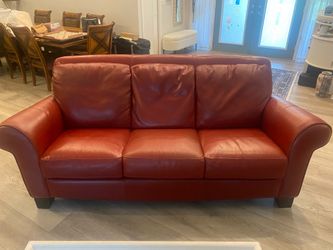 Red genuine, leather couch