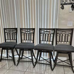 4 Wrought-Iron Swivel Bar Stools